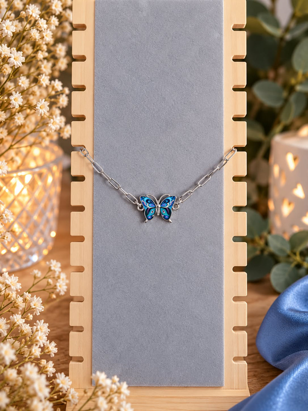 Bracelet papillon bleu à chaîne argentée